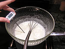 egg whites and sugar in a mixing bowl at 140 degrees