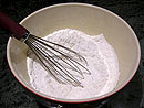 Flour, baking powder, baking soda, and salt in a bowl