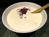 Combine the remaining cream with the honey, cranberries, and the dry ingredients,