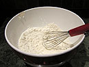 Mix the butter into the flour so that there are no large balls of grated butter