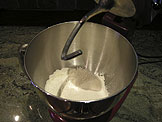 Place the flour in a mixing bowl with the dough hook attachmen