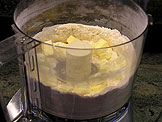 Put the butter pieces in the food processor