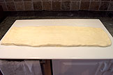 Roll the dough into a rectangle measuring 3 1/2 x 9 inches (8.75 x 22.5 cm) and about 3/4 an inch (2cm) thick