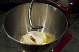 Sugar, butter, egg, and vanilla in a mixing bowl