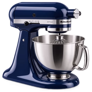 Stand mixer with stainless steel bowl and whisk attachment for baking